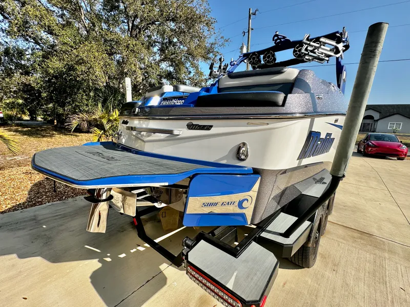 Slide: The Image of 2017 Malibu M235 boat on a trailer, ready for adventure. - 5
