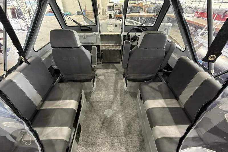 Slide: The Image of Interior of 2026 Hewescraft 190 Sea Runner ET boat with seating and steering wheel. - 10