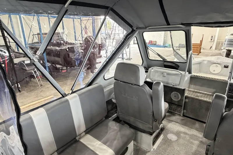 Slide: The Image of Interior of 2026 Hewescraft 190 Sea Runner ET, showcasing seating and helm area. - 12
