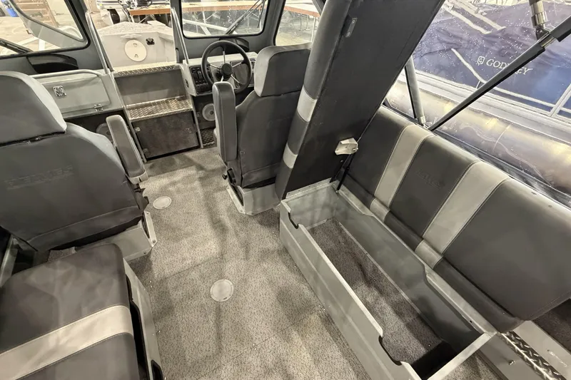 Slide: The Image of 2026 Hewescraft 190 Sea Runner ET interior with seating and steering wheel. - 14
