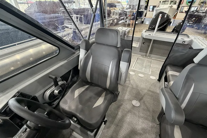 Slide: The Image of Interior of 2026 Hewescraft 190 Sea Runner ET boat, featuring modern seating and controls. - 15