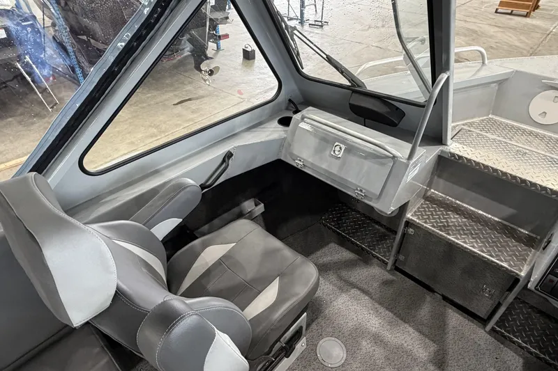 Slide: The Image of Interior of 2026 Hewescraft 190 Sea Runner ET, featuring modern seating and control panel. - 19