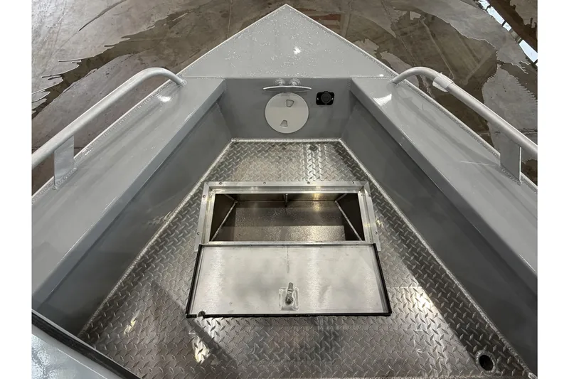 Slide: The Image of 2026 Hewescraft 190 Sea Runner ET boat interior with open storage compartment. - 23