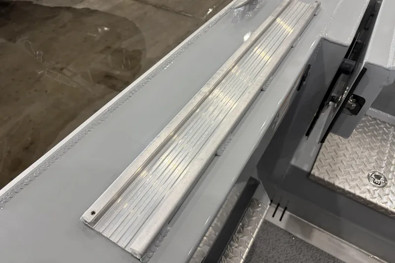 Slide: The Image of Interior view of 2026 Hewescraft 190 Sea Runner ET boat, featuring metal flooring and step detail. - 28