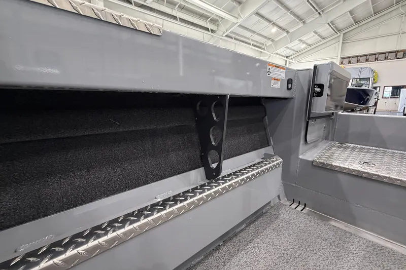 Slide: The Image of Interior view of 2026 Hewescraft 190 Sea Runner ET boat, showcasing storage and seating. - 9