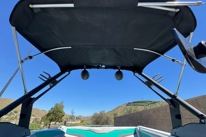 Slide: The Image of 2023 Axis T220 boat canopy with clear blue sky background. - 16