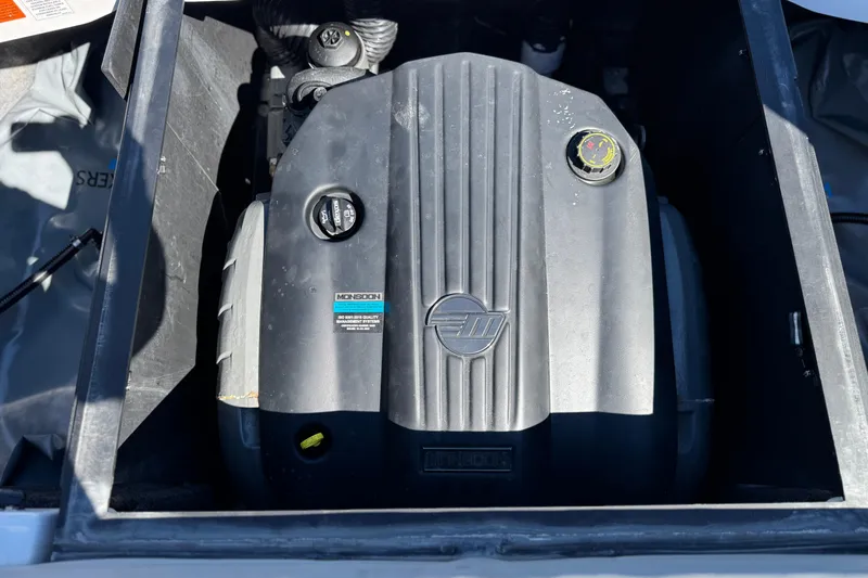 Slide: The Image of 2023 Axis T220 engine compartment with Monsoon engine cover. - 22