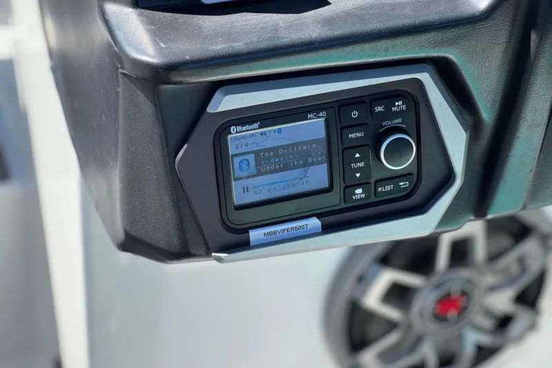 Slide: The Image of Close-up of a 2023 Axis T220 boat stereo system with Bluetooth connectivity. - 29
