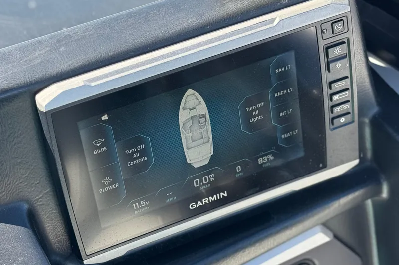 Slide: The Image of Garmin display in 2023 Axis T220 boat showing navigation and control options. - 32