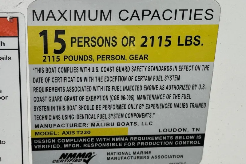 Slide: The Image of Axis T220 boat capacity label, 15 persons or 2115 lbs, 2023 model compliance. - 36