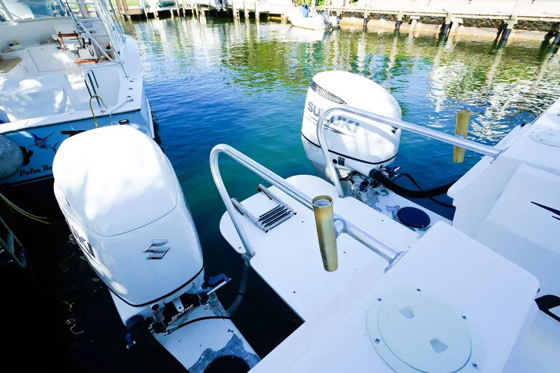 Slide: The Image of Powercat 30 Ope 2000 model with Suzuki outboard engines docked at marina. - 5
