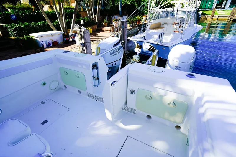 Slide: The Image of Powercat 30 Ope 2000 model docked, featuring spacious deck and Suzuki outboard engines. - 6