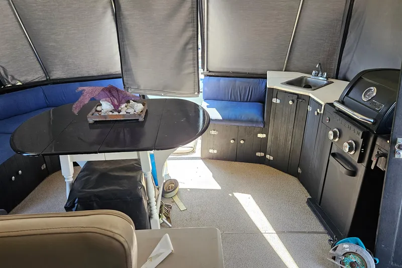 Slide: The Image of Two black leather chairs in a 1967 Hatteras 44 Tri Cabin interior. - 10