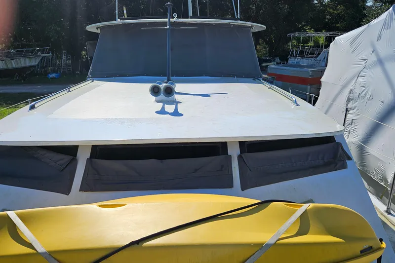 Slide: The Image of Interior of a 1967 Hatteras boat with modern seating and kitchen area. - 11