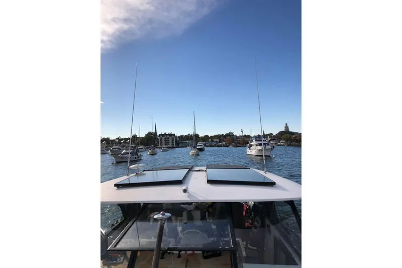 Slide: The Image of 1967 Hatteras 44 Tri Cabin interior with modern seating and natural light. - 12