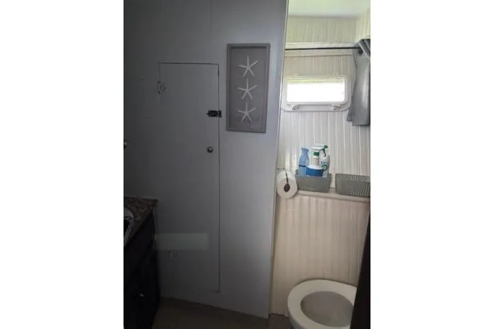 Slide: The Image of Bathroom interior of 1967 Hatteras 44 Tri Cabin yacht with window and storage. - 22