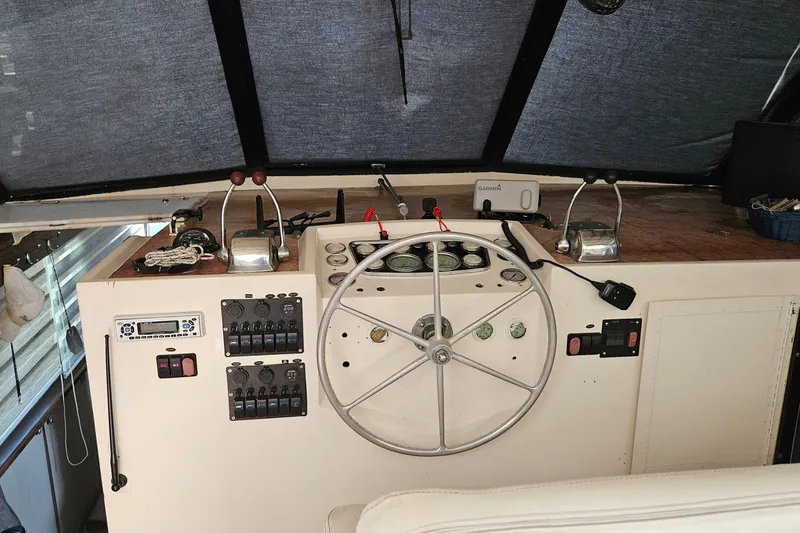 Slide: The Image of Interior of a 1967 Hatteras boat with dining area, kitchenette, and grill. - 7