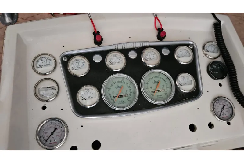Slide: The Image of 1967 Hatteras boat with yellow kayak on deck, parked outdoors. - 8