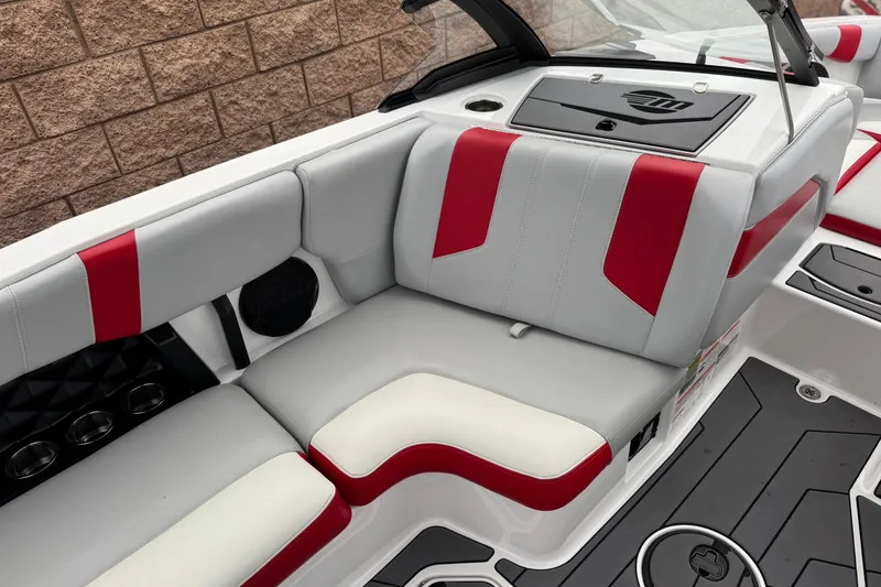 Slide: The Image of 2023 Malibu Wakesetter 21 LX interior with red and gray seating, modern design. - 24