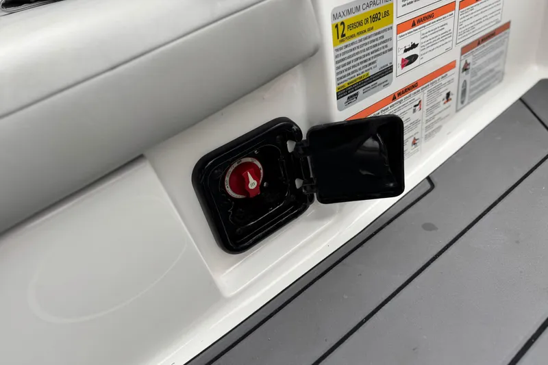 Slide: The Image of 2023 Malibu Wakesetter 21 LX safety labels and battery switch detail. - 26