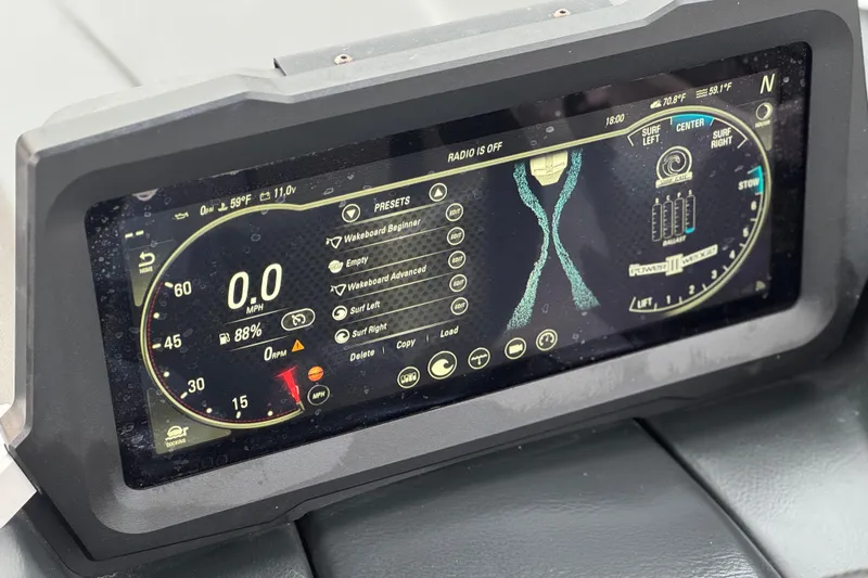 Slide: The Image of 2023 Malibu Wakesetter 21 LX dashboard display with speedometer and surf settings. - 31