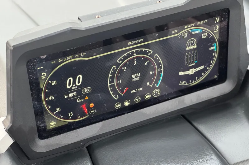 Slide: The Image of 2023 Malibu Wakesetter 21 LX dashboard display showing speed, RPM, and system status. - 33
