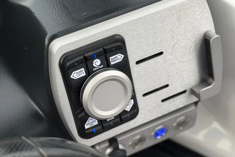 Slide: The Image of Control panel of 2023 Malibu Wakesetter 21 LX boat with surf and wedge adjustments. - 34