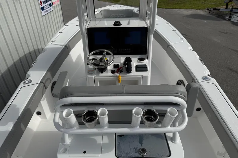 Slide: The Image of 2026 Blazer Bay Makaira 2600 boat interior with steering console and rod holders. - 11