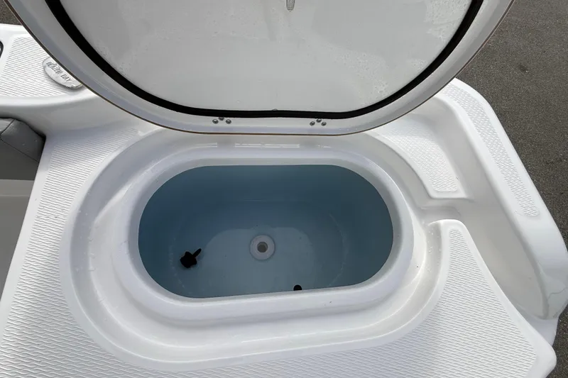 Slide: The Image of Livewell compartment on 2026 Blazer Bay Makaira 2600 boat, open lid view. - 19