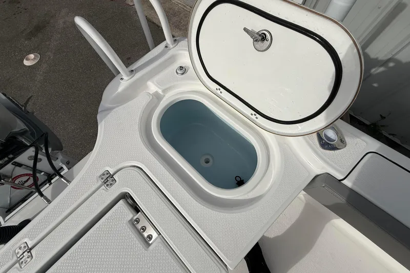 Slide: The Image of Livewell compartment on 2026 Blazer Bay Makaira 2600 boat, open with visible interior. - 20