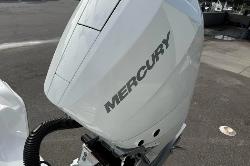Slide: The Image of 2026 Blazer Bay Makaira 2600 with Mercury outboard engine, close-up view. - 21