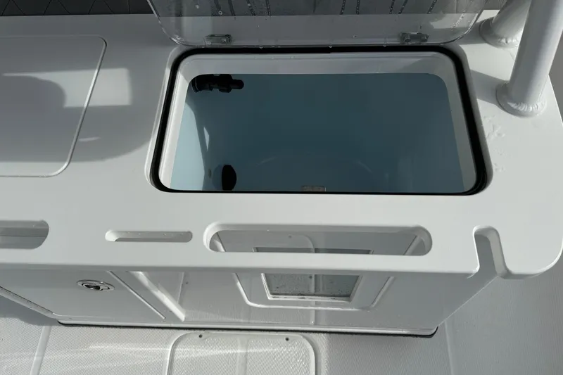 Slide: The Image of Livewell compartment on 2026 Blazer Bay Makaira 2600 boat, open lid view. - 24
