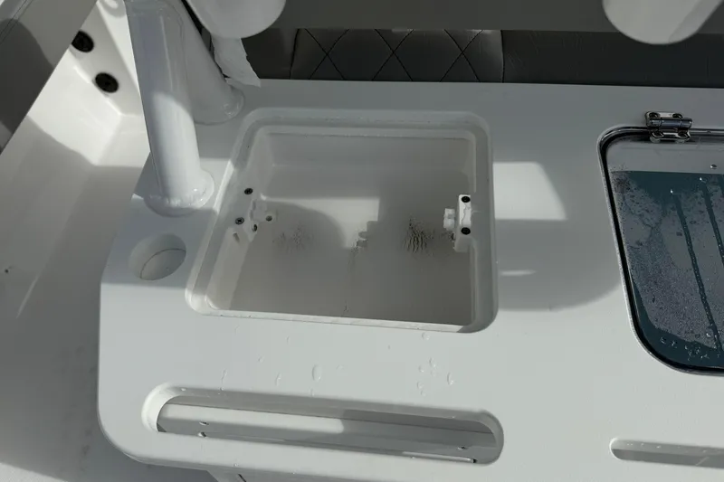 Slide: The Image of 2026 Blazer Bay Makaira 2600 boat deck with storage compartments and rod holders. - 25