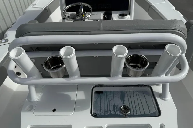 Slide: The Image of 2026 Blazer Bay Makaira 2600 boat interior with rod holders and steering wheel. - 26