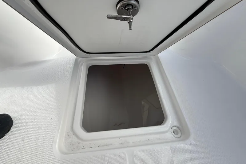 Slide: The Image of Open storage compartment on 2026 Blazer Bay Makaira 2600 boat deck. - 34