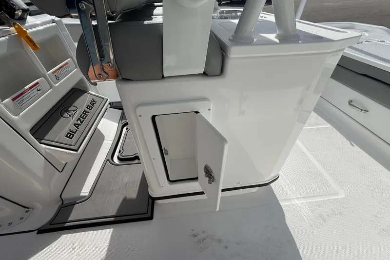 Slide: The Image of 2026 Blazer Bay Makaira 2600 boat interior with open storage compartment and seating. - 42