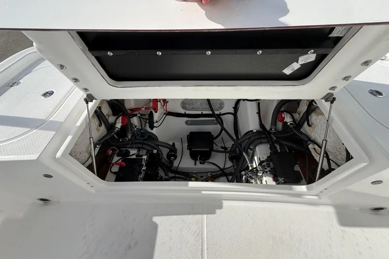 Slide: The Image of Open engine compartment of 2026 Blazer Bay Makaira 2600 boat, showcasing wiring and components. - 44