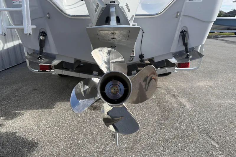 Slide: The Image of 2026 Blazer Bay Makaira 2600 boat propeller, rear view on pavement. - 47