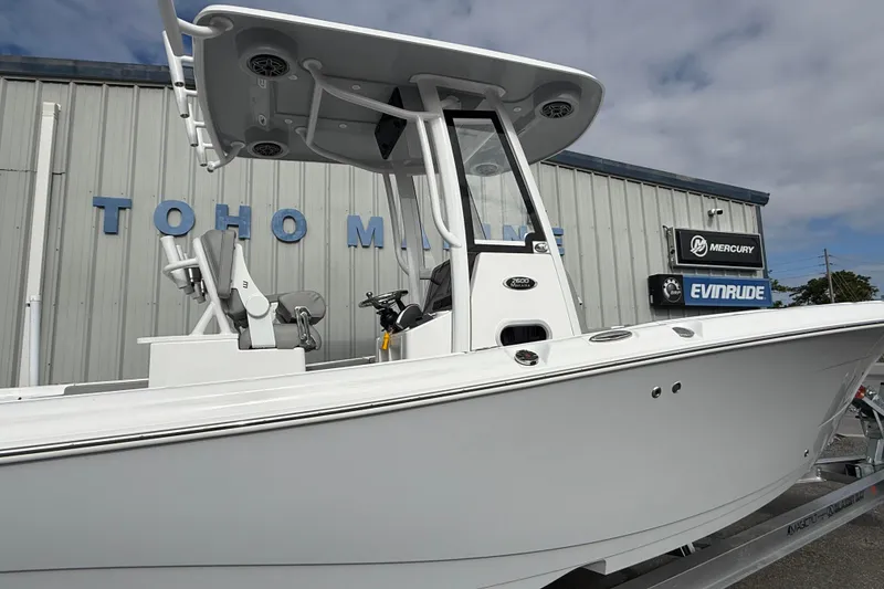 Slide: The Image of 2026 Blazer Bay Makaira 2600 boat displayed at dealership with Mercury and Evinrude signage. - 6