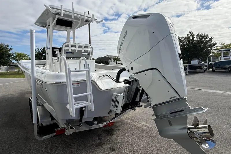 Slide: The Image of 2026 Blazer Bay Makaira 2600 boat with Mercury engine, parked outdoors. - 8