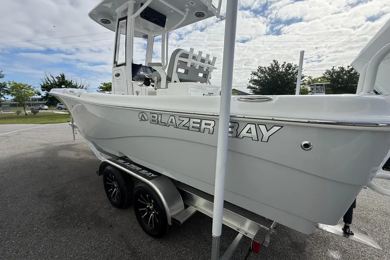 Slide: The Image of 2026 Blazer Bay Makaira 2600 boat on trailer, showcasing sleek design and modern features. - 9