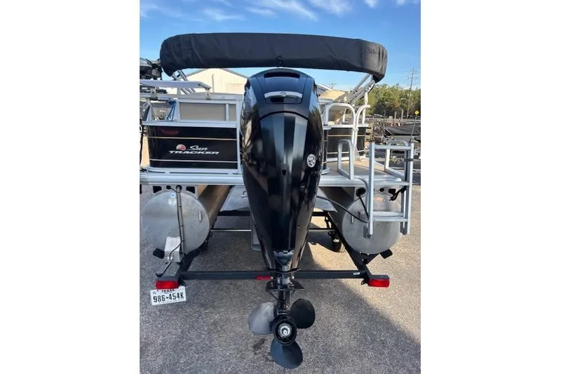 Slide: The Image of 2021 Sun Tracker Bass Buggy 18 DLX pontoon boat with outboard motor, rear view. - 59