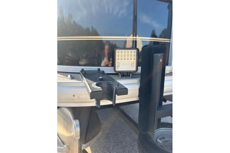 Slide: The Image of 2021 Sun Tracker Bass Buggy 18 DLX with mounted LED light and trailer detail. - 62