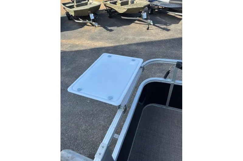 Slide: The Image of 2021 Sun Tracker Bass Buggy 18 DLX boat with a foldable table attachment. - 68