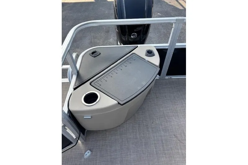 Slide: The Image of 2021 Sun Tracker Bass Buggy 18 DLX boat deck with storage compartment and cup holder. - 71