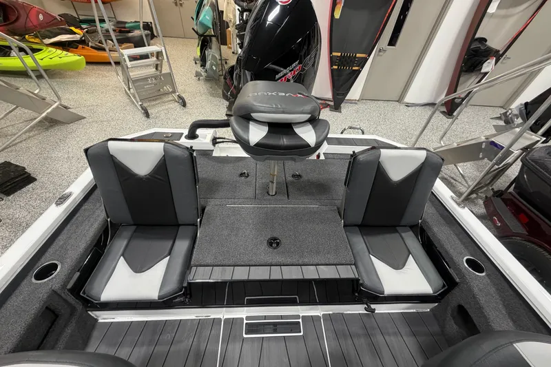 Slide: The Image of 2026 Vexus AVX 2085S boat interior with seating and motor in a showroom. - 12