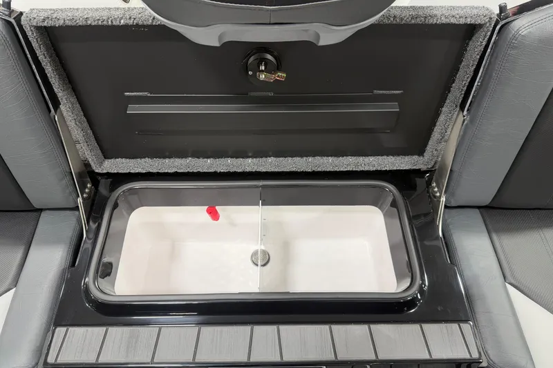 Slide: The Image of 2026 Vexus AVX 2085S boat storage compartment with open lid and interior view. - 14