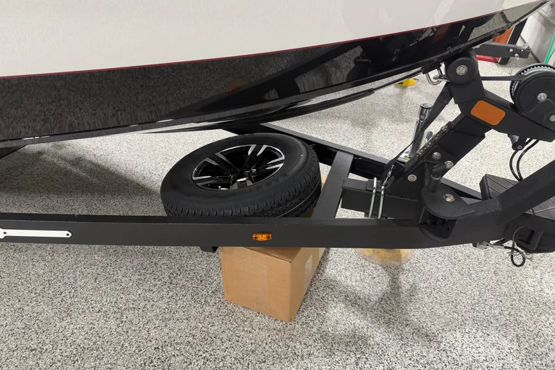 Slide: The Image of 2026 Vexus AVX 2085S boat trailer with spare tire on a garage floor. - 5