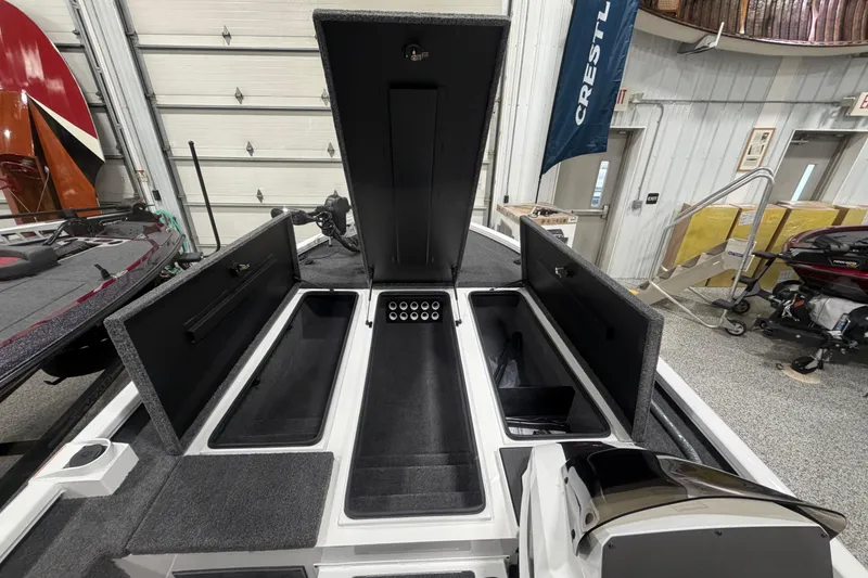 Slide: The Image of 2026 Vexus AVX 2085S boat interior with open storage compartments in a showroom. - 7