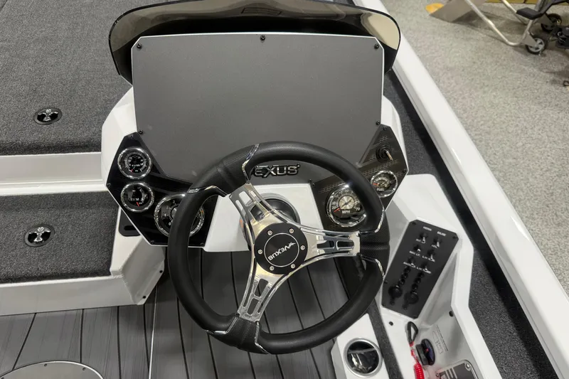 Slide: The Image of Steering console of 2026 Vexus AVX 2085S boat with gauges and controls. - 9